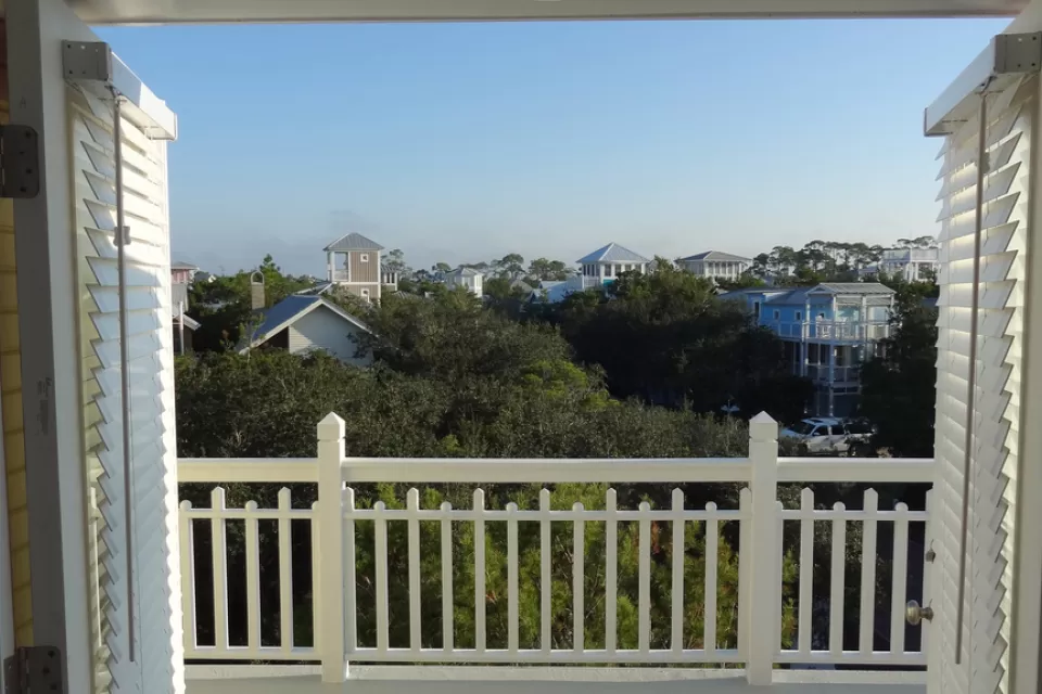 view out a window of rooftops of Seaside, Florida